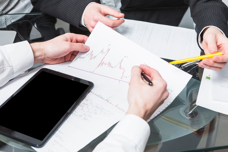 Businesspeople Analyzing Report Office